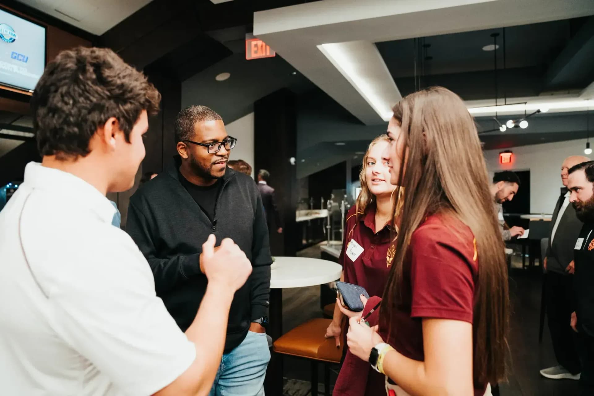 Sports professionals connecting at an industry event